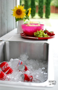 DIY outdoor party buffet in pool blue using...the kitchen sink! www.huntandhost.net