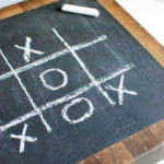This thrifted old butcher block gets a chalkboard makeover to display a fun game of tic tac toe for the family! www.huntandhost.net