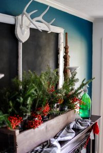My Christmas farmhouse homes tour, featuring a sled centerpiece, vintage hat boxes, fresh cut greenery and pops of red and green.