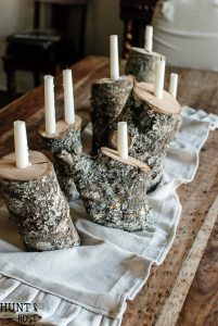 This easy DIY tutorial will show you how to take tossed firewood and turn it into a beautiful rustic winter tablescape by creating log candlesticks.