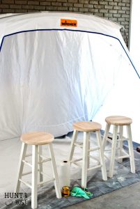 Cheap to chic bar stool makeover. See how quick and easy you can transform projects with a paint sprayer and tent. A paint spray tent provides protection and easy clean up for a messy painter like me.