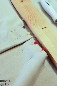 Make inexpensive custom curtains from old wood and dropcloth. Dropcloth curtains are soft and casual, rich wood is the finishing touch. Easy DIY curtain tutorial.