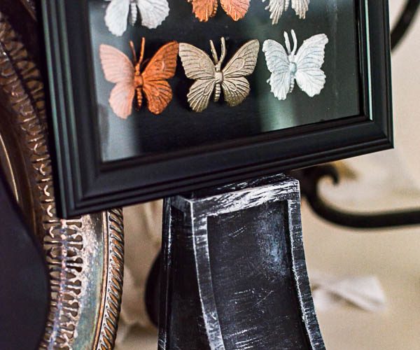 Halloween decorating ideas from the dollar store. These gilded bugs display cases are glamorous and easy to make Halloween décor.