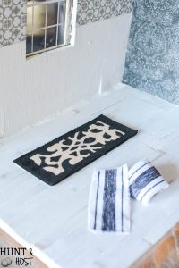 DIY dollhouse textile ideas. Cute dollhouse rugs, simple dollhouse pillow ideas and cute little DIY dollhouse curtains! Farmhouse style dollhouse accessories are easy and fun to make yourself! Part of the one room challenge!