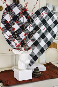 This giant DIY for Valentine's Day can be made in any size and would be great for other holidays! DIY Valentine's Day decor hearts are easy to style to your decor, black and white buffalo check and plaid shirt patterns add a fun touch instead of traditional Valentine pink!