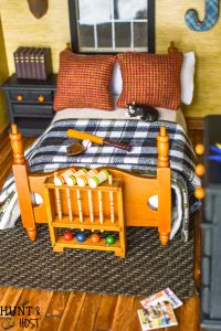 How precious is this rustic boys bedroom? These dollhouse bedroom ideas are perfect for the outdoor loving little boy, deer mount and all!