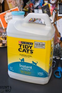 Turn your empty kitty litter jugs into cute storage buckets. Upcycling empty containers for inexpensive DIY organizing is quick and easy!