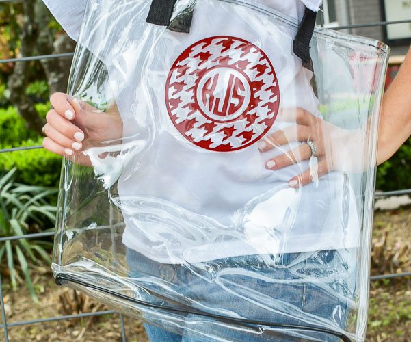 An inexpensive dollar store tote bag gets a cute makeover with a personalized monogram, perfect for summer gift or football game clear tote bag! You will look great by the pool or beach with this clear bag!