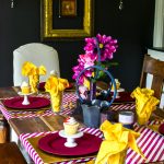 Create a table setting inspired by The Greatest Showman! Perfect for a glam circus theme dinner or just for a cute Greatest Showman tablescape to entertain the family. Anne's pink hair and the smell of peanuts round out this glitzy gold and fuchsia party scene.