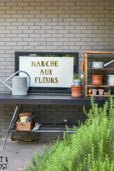 How to make a sleek potting table. This potting bench, painted black is a departure from the chippy white farmhouse look. Plus three must see ideas for professional and fast painted outdoor furniture.