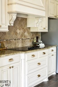 New kitchen hardware adds instant vintage feel and upgrades your builder grade selections in an afternoon! This easy DIY install is perfect to make your boring kitchen cabinets stand out. #kitchenupgrade #goldhardware #kitchengoals #frenchcountrydecor