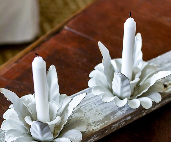 Marry your old wedding candelabra to a picket fence board for the cutest DIY hime decor with vintage style. This quick and easy DIY candle holder get you thinking about what other thrifted finds you can take apart and put back together again in a more useful way! #candleholder #picketfenceproject #thriftedfind #cottagestyle #farmhousedecor #farmhousecandle #cottagedecor #makeitnew