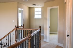 Before pictures of a very vanilla builder grade home ready to get a personal and cozy makeover on a budget full of DIY ideas, tips and tricks. Follow along this cookie cutter home makeover!