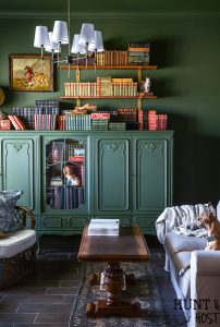 Built in cabinets can be expensive, read all the reasons to use open shelving vs built-in storage for a more stylish and affordable home. Make your study or library room cozy and charming with this moody green paint and faux built-in. #fremchcountrycottage #libraryroom #openshelf #storageideas #DIYcabinet #DIYstorageidea #frenchcountryoffice