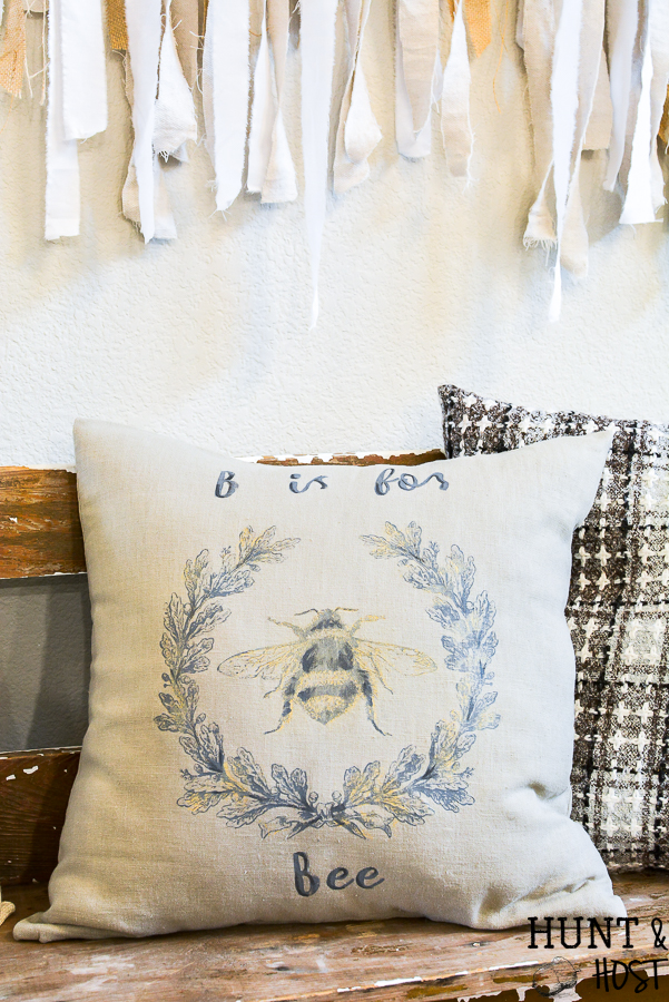 This stunning DIY Bee pillow is perfect for a teacher gift or your classic decorative pillow stash. Quick and easy to make with stencils from a Maker's Studio Chalk Art collection. Complete with a list of the products you need to make your own DIY bee pillow cover!