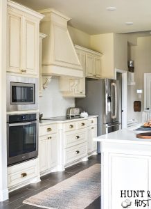 This plain spec house kitchen gets a beautiful upgrade to a French country classic kitchen with these great kitchen renovation ideas and resources. Change your builder grade kitchen into a classic kitchen you love! #kitchenrenovation #frenchcountrykitchen#spechome #buildergraderenovation #kitchenremodel #farmhousekitchen