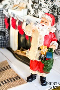 It's Christmas time in the dollhouse. Come see a dollhouse Santa, DIY stockings and miniature gingerbread. All the mini details of this holiday dollhouse are precious!