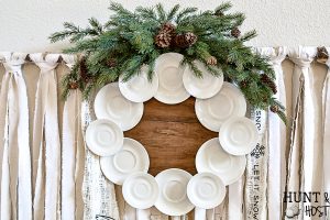 Make your own gorgeous wreath from vintage ironstone plates or hotel china. This DIY ironstone plate wreath tutorial is so simple and is perfect for vintage farmhouse decor. #ironstone #vintagewreath #roundtop #antiquesweek #wreathmaker