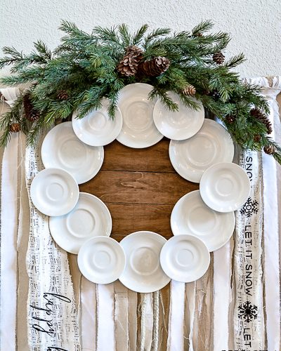 Make your own gorgeous wreath from vintage ironstone plates or hotel china. This DIY ironstone plate wreath tutorial is so simple and is perfect for vintage farmhouse decor. #ironstone #vintagewreath #roundtop #antiquesweek #wreathmaker