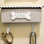 Cute idea to repurpose a vintage mailbox into a dog walking station. Upcycled storage solutions are the best! It's great to have a useful and stylish organiztion idea up your sleeve, especially when it comes to a good way to store pet supplies like dog leashes and treats. #petstorage #dogwalkingstation #vintagestyle #mailboxupcycle