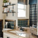 Decorating ideas for a small rustic bathroom. Perfect for a bunch ob boys and a casual cabin bathroom decor. With easy DIY open shelving and faux wall panels, there are some great bathroom decorating ideas here. #rusticbathroom #smallspaceideas #boysbathroom #fauxwallpaper #openshelving #shelfbrackets #DIYstorage #plaidwalls #rusticbathroomcolors #simpleideas