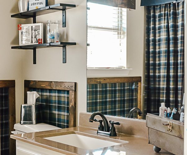 Decorating ideas for a small rustic bathroom. Perfect for a bunch ob boys and a casual cabin bathroom decor. With easy DIY open shelving and faux wall panels, there are some great bathroom decorating ideas here. #rusticbathroom #smallspaceideas #boysbathroom #fauxwallpaper #openshelving #shelfbrackets #DIYstorage #plaidwalls #rusticbathroomcolors #simpleideas