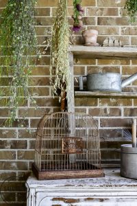 Get a French country porch with this vintage flower drying rack idea, perfect for drying herbs and adding a beautiful focal point to your outdoor patio. #wildflower #frenchporch #DIYherbdrying #plantdrying #plantdryingrack #herbgarden #porchquiltdiy #vintagegarden #outdoorlivingidea #outdoordecorating