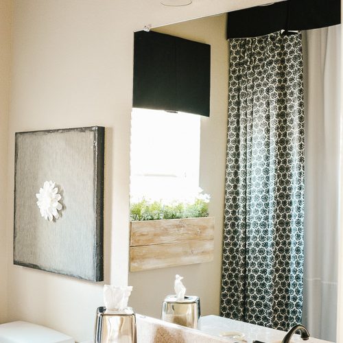 Steal some cozy black and white bathroom ideas to decorate you bathroom into a haven! The floor to ceiling shower curtain treatment and indoor window flower box are fabulous! #blackandwhitedecor #blackandwhitebathroom #teenbathroom #cozybathroomidea #showercurtainideas #DIYwindowbox #indoorwindowbox #tweengirldecorating