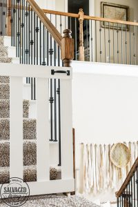 How to build a stylish stairway gate to keep pets or kids out! This easy DIY gate tutorial will look great and blend with your traditional decor. We keep our dog off the carpet with this pet gate. #petgate #stairgate #childproof #DIYpet #cleancarpet #doggate #petgatediy #petgateforstairs