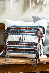 This decorative DIY patriotic pillow cover is perfect for your summer decor, plus it's perfect for a quick seasonal pillow change on a budget. #easyDIYpillows #decorativepillows #fourthofjulypillow #4thofjulydecorations #scrapfabricproject #patrioticdecor
