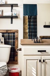 Get a free art print, perfect for a boy's bathroom or bedroom. This bathroom is full of great decorating ideas, especially updated hardware, wall treatments and shower curtain ideas! #boysbathroom #rustichardware #cabinethardware #rusticcabindecor #smallbathroomdecor #bathroomdetails #hickoryhardware