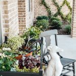Here are some easy tips for porch decorating on a budget. You will gets great ideas for your patio decor plus some tips on how to use a paint sprayer on your patio furniture. #porchdecor #budgetdecorating #patiofurnituremakeover #garageslaemakeover #garagesalefinds #repurpose #howtopaintfurniture #wagnersprayer