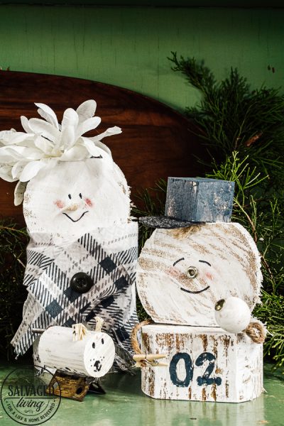 Learn how to make a cheap and easy DIY scrap wood snowmen family. The perfect Christmas decoration or gift idea for a family. This easy snowman craft lets you personalize each snowman face and outfit with junk art from your house! #holidaydecor #handandeChristmas ##snowmancrafts #woodensnowmen #farmhouseChristmas