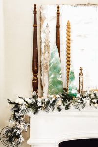 Decorate your mantel with these budget friendly ideas this Christmas! Plus I have a great tip on how to hang garland without nails for damage free decorating! This simple cardboard craft rounds out the Christmas fireplace decorations! #DamageFreeHolidayDecor #CommandDoNoHarm #cardboarddecor #fireplacedecor #vintageChristmas #budgetgarland #easyChristmasdecor