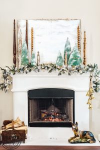 Decorate your mantel with these budget friendly ideas this Christmas! Plus I have a great tip on how to hang garland without nails for damage free decorating! This simple cardboard craft rounds out the Christmas fireplace decorations! #DamageFreeHolidayDecor #CommandDoNoHarm #cardboarddecor #fireplacedecor #vintageChristmas #budgetgarland #easyChristmasdecor