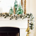 Decorate your mantel with these budget friendly ideas this Christmas! Plus I have a great tip on how to hang garland without nails for damage free decorating! This simple cardboard craft rounds out the Christmas fireplace decorations! #DamageFreeHolidayDecor #CommandDoNoHarm #cardboarddecor #fireplacedecor #vintageChristmas #budgetgarland #easyChristmasdecor
