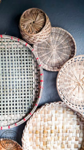 everything you need to know about creating basket gallery wall art. Where to find vintage baskets, how to hang baskets and how to layout a basket gallery wall are all here in this gorgeous gallery wall trend idea. #vintagedecor #wovenbaskets #basketwall #gallerywall
