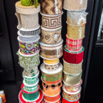 DIY ribbon storage idea to organize your craft room ribbons. This Ribbon storage rack idea is perfect for all the beautiful ribbons taking over your craft space that needs organizing! #ribbonstorage #wreathmaker #diyideas