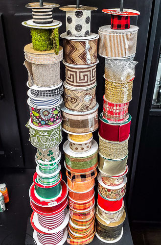 DIY ribbon storage idea to organize your craft room ribbons. This Ribbon storage rack idea is perfect for all the beautiful ribbons taking over your craft space that needs organizing! #ribbonstorage #wreathmaker #diyideas