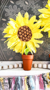 DIY paper sunflowers for home decor mantel idea. Make these giant sunflowers out of tissue paper for your summer mantel decor or make small paper sunflowers for an easy centerpiece idea or vignette styling. #summerdecor #papercraft #budgetdecor