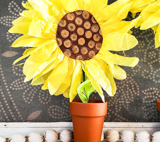 DIY paper sunflowers for home decor mantel idea. Make these giant sunflowers out of tissue paper for your summer mantel decor or make small paper sunflowers for an easy centerpiece idea or vignette styling. #summerdecor #papercraft #budgetdecor