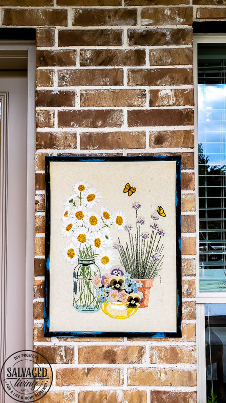 Learn how to hang pictures on brick wall easily with this step by step tutorial. Haning pictures on brick is easy with the right tools and can make your outdoor living space feel like a cozy room in your home. #howtotip #decoratinghack #patiodecoridea