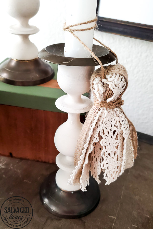 Try this easy update for your thrift store candlestick makeover. SUch a simple idea to update an old candlestick instead of tossing it for simple and classic DIY home decor. #diyhomedecor #thriftedmakeover #tassel