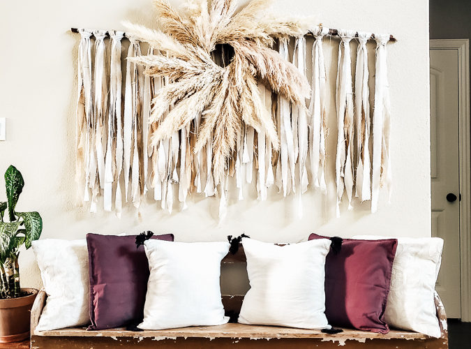 Learn how to make your own Pampas Grass Wreath, this DIY tutorial is easy to follow and perfect for gorgeous fall home decor. A Pampas Grass Wreath adds luxurious beauty to your living room or mantel for a boho chic look that only nature decor can provide! #pampasgrasslivingroom #wreathmaking #wreathtutorial #decoratingwithnature