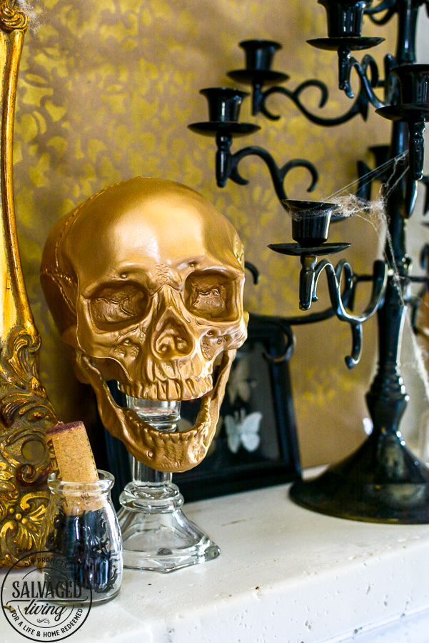 welcome to the Haunted Midas Mansion. These easy DIY Halloween mantel decoration ideas will inspire you to create an elegant Halloween home decor aesthetic that is a little bit vintage, kind of spooky and tons of fun. #indoorHalloween #Halloweendecorating #goldHalloweendecor 
