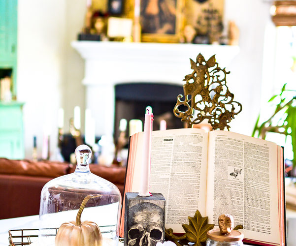 Easy DIY Halloween decor idea that you can craft in minutes. Use this DIY Halloween home decor as a candlestick, shelf sitter, Halloween vignette or table decor idea. Dollar store supplies are perfect for this Halloween idea to make budget friendly Halloween home decorating! #halloweencraft #Halloweenvignette #dollarstorehalloween