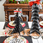 Amazing budget friendly Christmas decorating ideas including a chalkboard Christmas tree made out of cardboard. Cardboard craft ideas to use in your holiday decorating that are so adorable, like a glittery plate charger, ribbon table runner and more ideas to try. #buffalocheck #chalkboardcraft #DIYChristmas #cardboardcraft