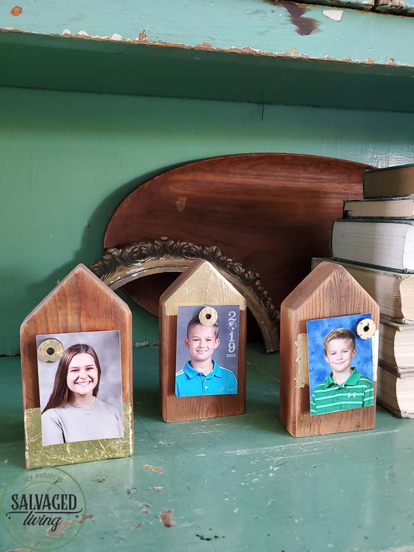 Make your own scrap wood picture holder house with this easy DIY that takes home made up anotch with gold leaf gilding for a modern touch on rustic charm for a great way to display kid's school pictures in style! #schoolpicture #scrapwoodproject #pictureframeidea #goldleafproject