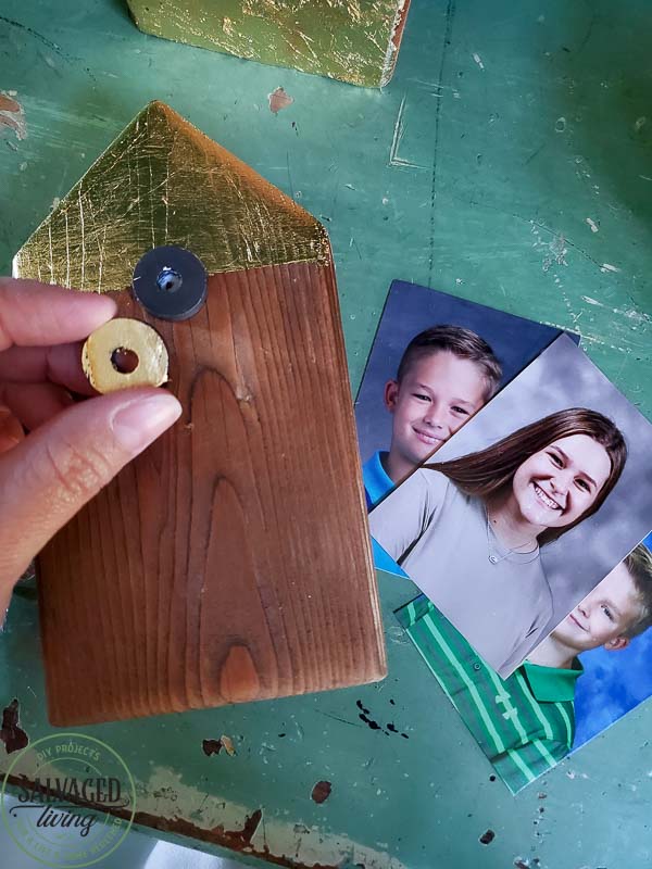 Make your own scrap wood picture holder house with this easy DIY that takes home made up anotch with gold leaf gilding for a modern touch on rustic charm for a great way to display kid's school pictures in style! #schoolpicture #scrapwoodproject #pictureframeidea #goldleafproject