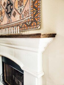 See how to make a stone fireplace mantel into a wood fireplace mantel. This DIY mantel idea is perfect for the person who loves to decorate their mantel but struggles with how to hang deocr on stone mantel or concrete mantel. It is an easy fireplace fix for a more functional fireplace mantel. #woodmantel #DIYmantel #manteldecor #stonefireplaceidea